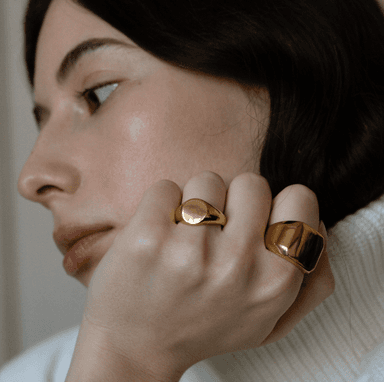 Woman wearing chunky gold rings